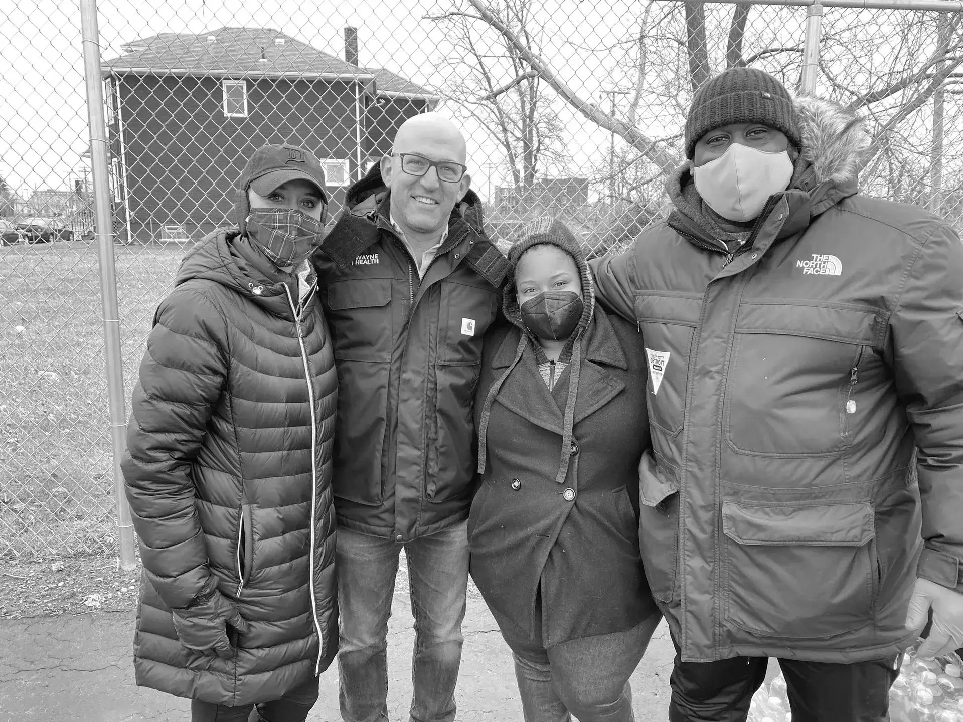 A group of people standing next to each other.