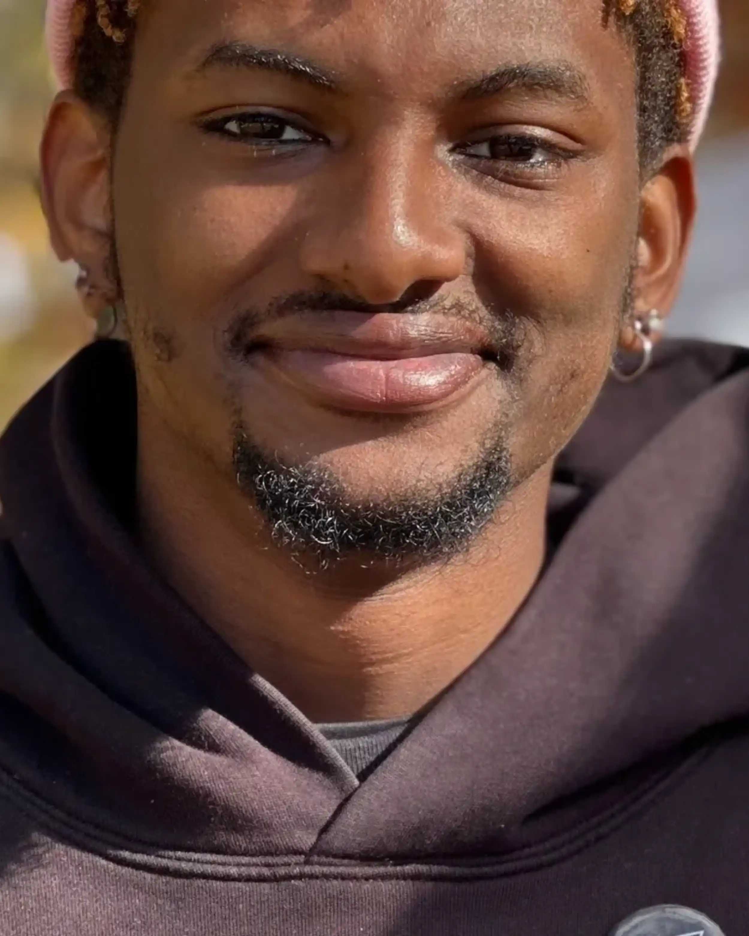A man with a beard and mustache wearing a black shirt